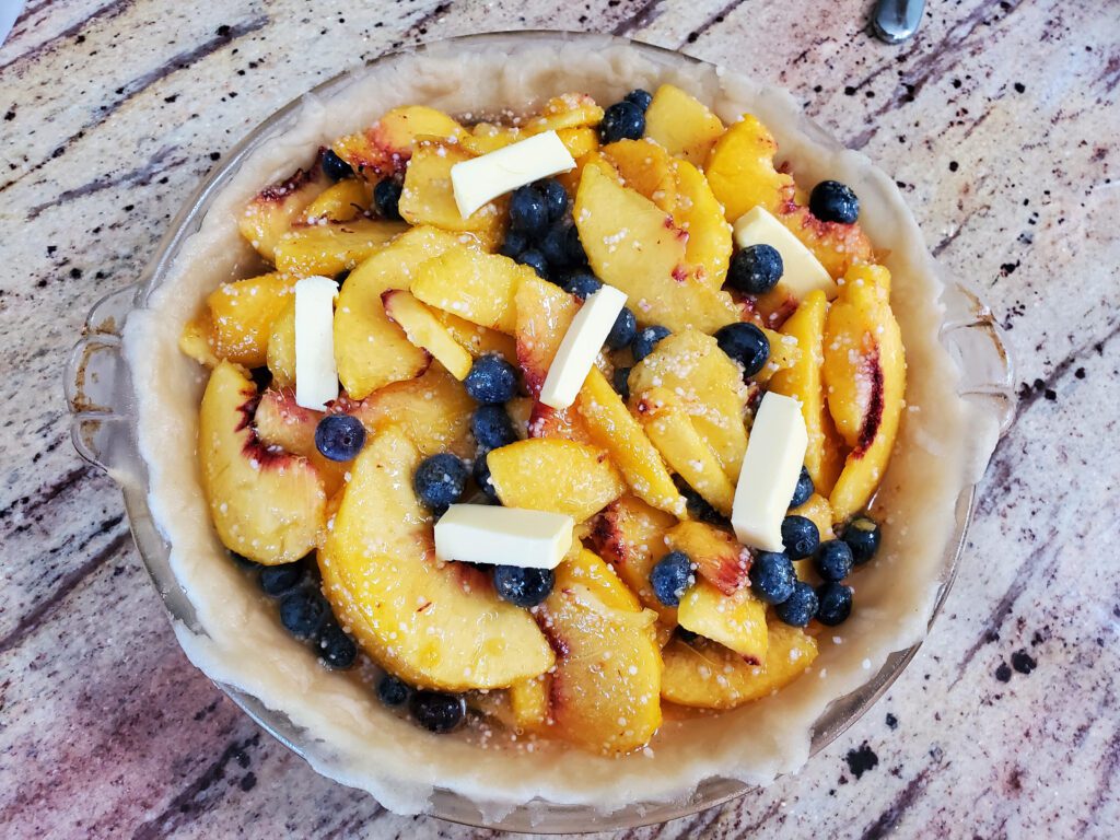 pie crust with peach blueberry pie filling
