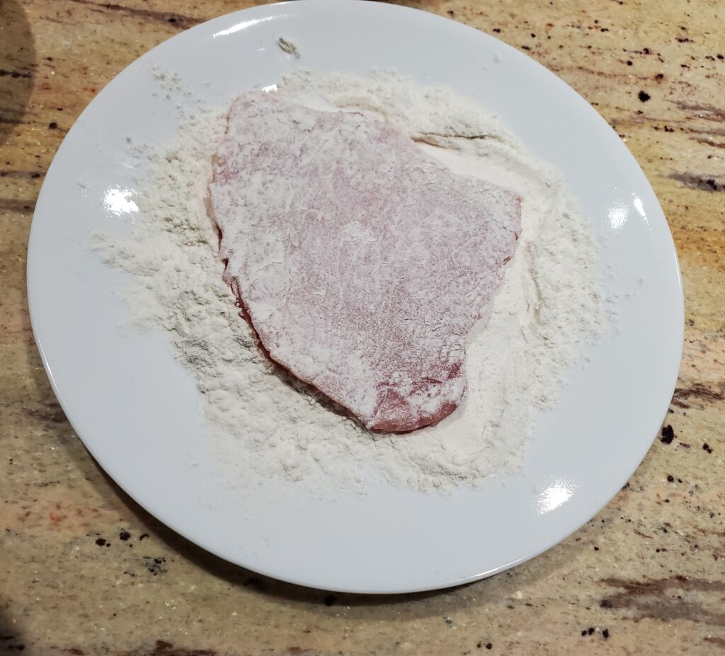 coating pork in flour