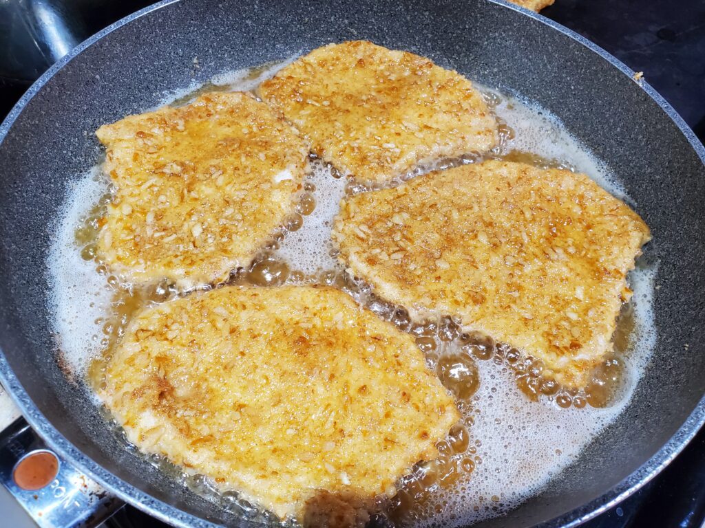 schnitzel in frying pan