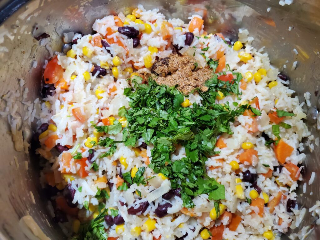Add cilantro and jerk seasoning to Caribbean rice.