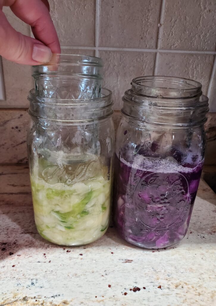 add jam jars to hold cabbage down