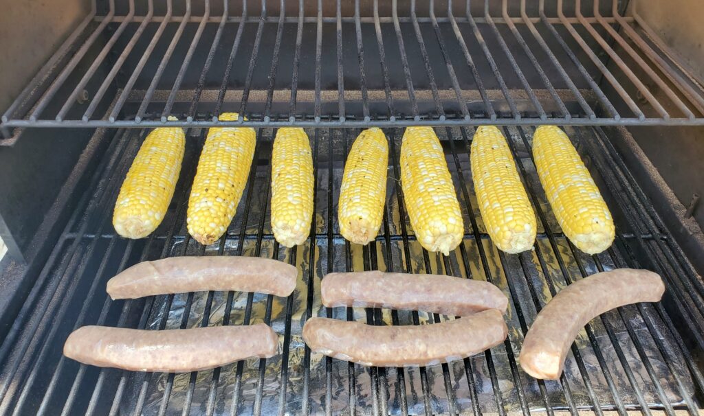 Corn on the cob and sausage on the Traeger