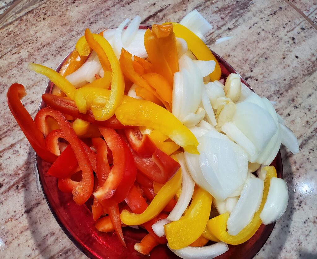 Sliced peppers, onions and crushed garlic.