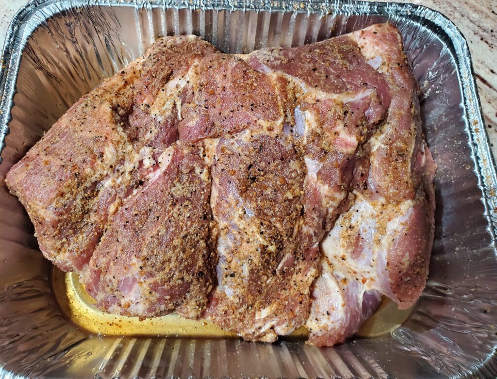 Seasoned and trimmed pork butt