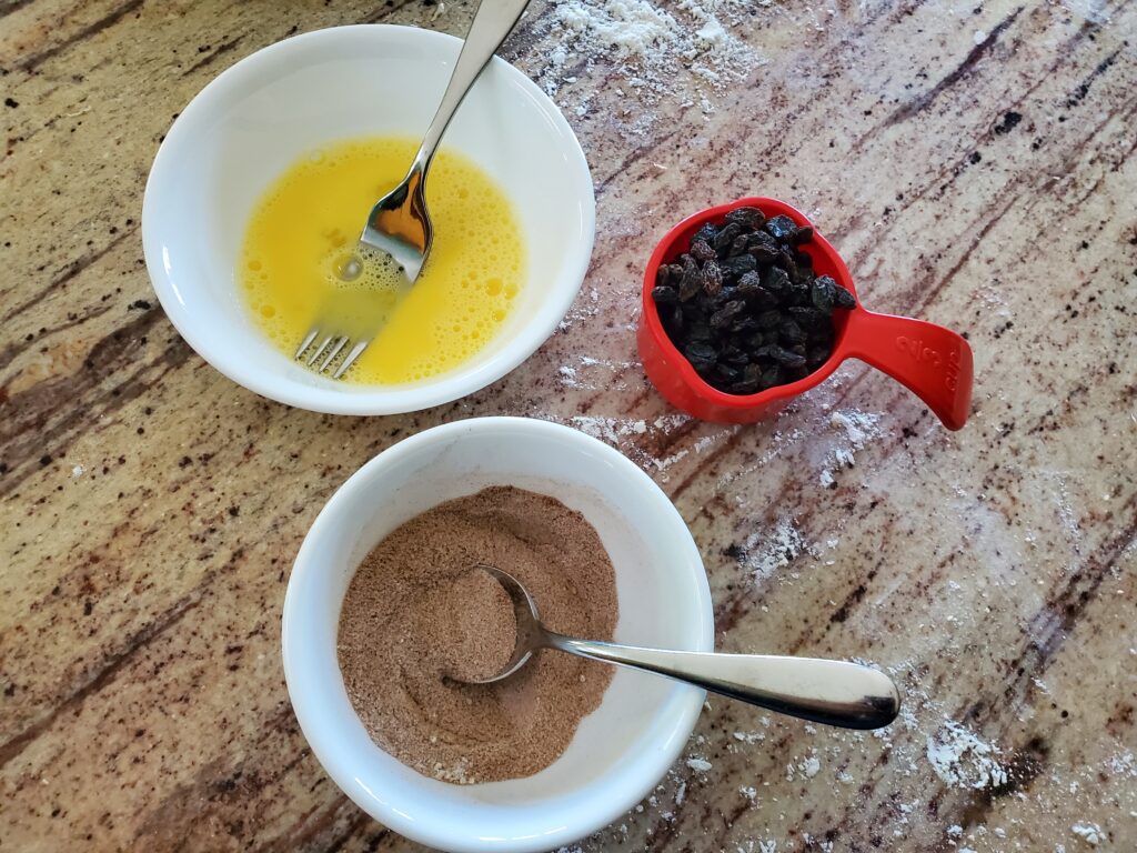 egg mixture, cinnamon sugar, and raisins