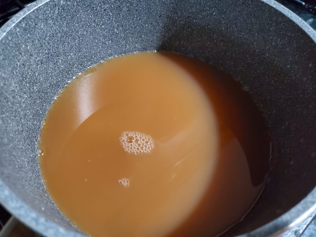 Apple cider in a sauce pan