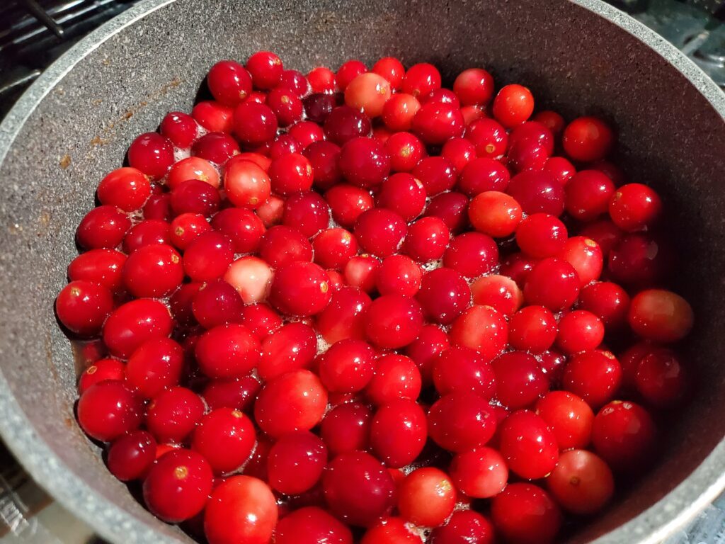 add cranberries to pan