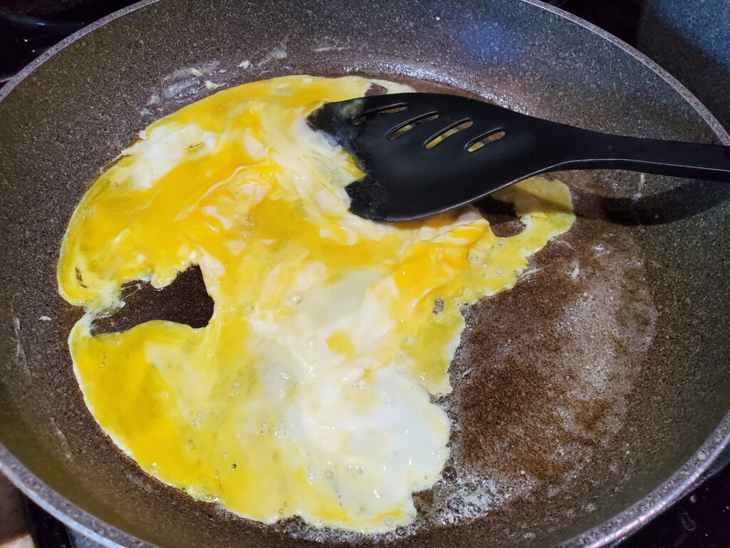 Scramble the egg with butter