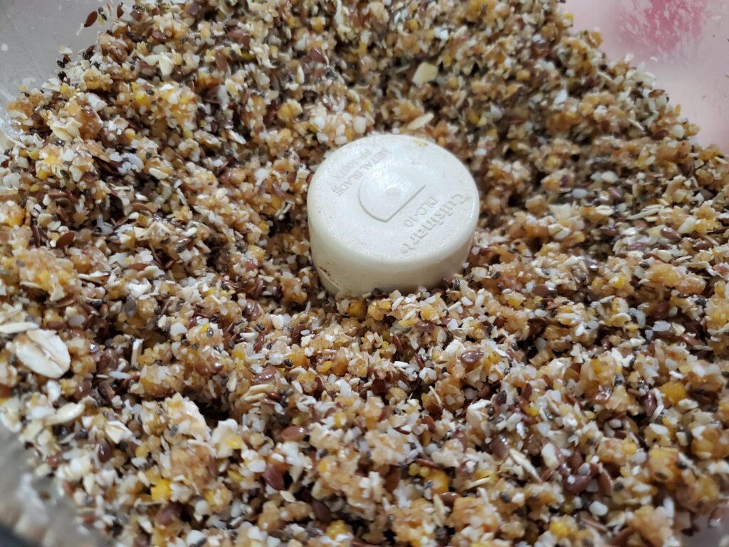 tropical energy ball ingredients in a food processor
